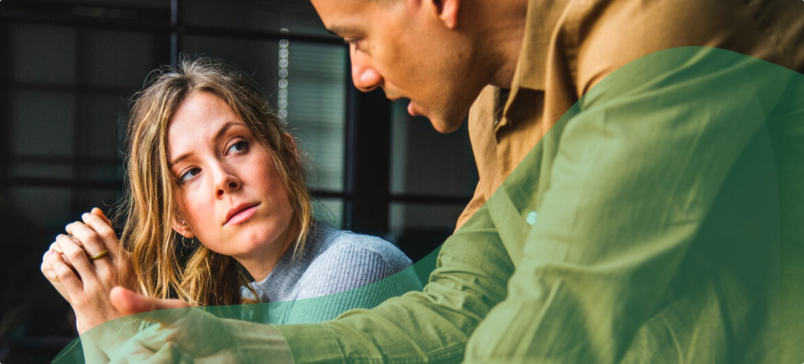 Image of two coworkers sharing ideas